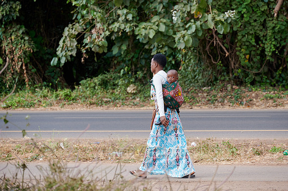 Local woman with child in colorful clothes