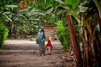 Local woman with child in colorful clothes