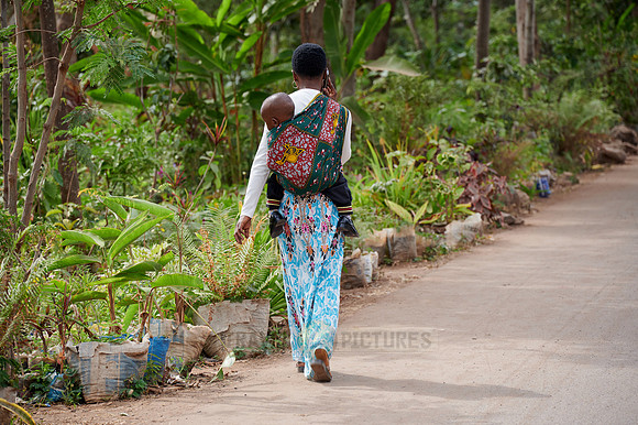 Local woman with child in colorful clothes