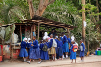 school children in uniform at a sales booth