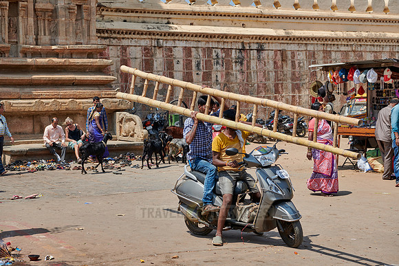 locals with ladder on motorbike