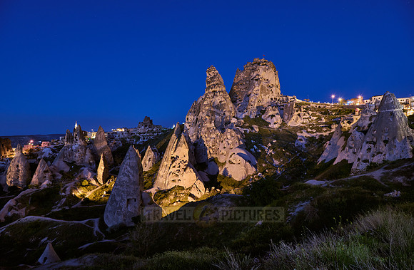Twilight photo of the perforated castle rock of Uçhisar