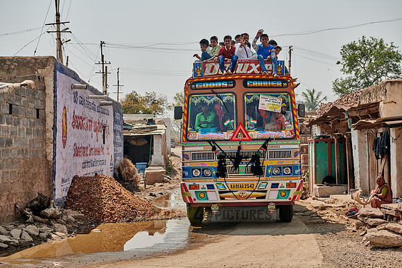 truck used as bus loaded with people