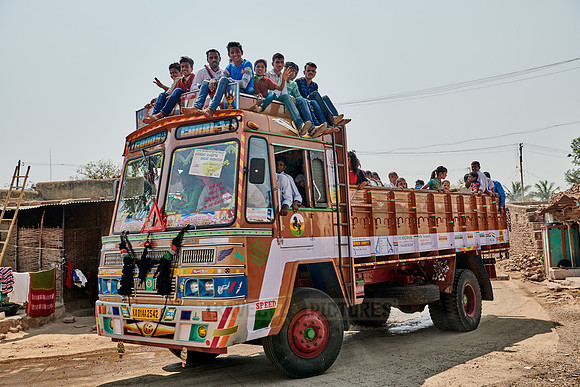 truck used as bus loaded with people