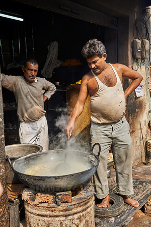 man is cooking street food