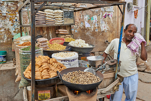 man is cooking street food