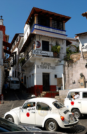 VW bus or VW Beetle in the cityscape of Taxco