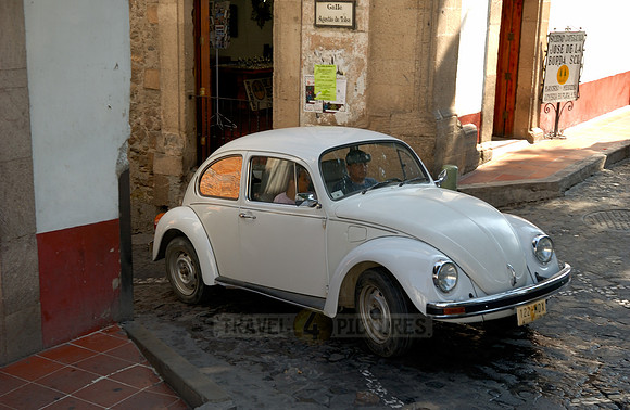 VW bus or VW Beetle in the cityscape of Taxco