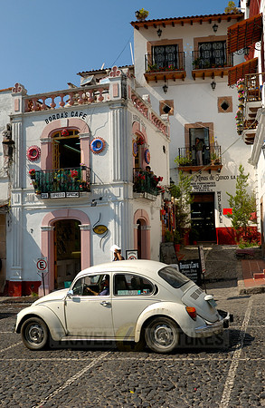 VW bus or VW Beetle in the cityscape of Taxco