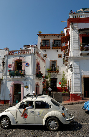 VW bus or VW Beetle in the cityscape of Taxco