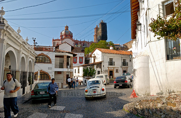 City view with San Sebastian y Santa Prisca Church and typical buildings
