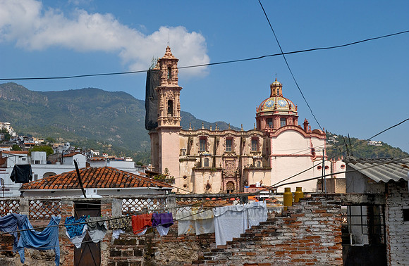 City view with San Sebastian y Santa Prisca Church and typical buildings