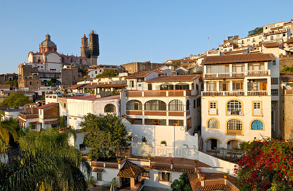 City view with San Sebastian y Santa Prisca Church and typical buildings