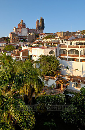 City view with San Sebastian y Santa Prisca Church and typical buildings