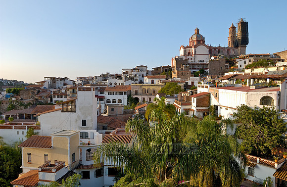 City view with San Sebastian y Santa Prisca Church and typical buildings
