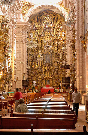 heavily decorated high altar made of gold leaf of the Church of San Sebastian y Santa Prisca
