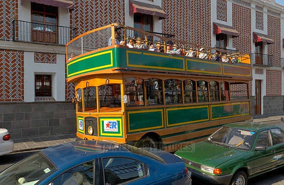 double-decker bus with tourists on the city tour