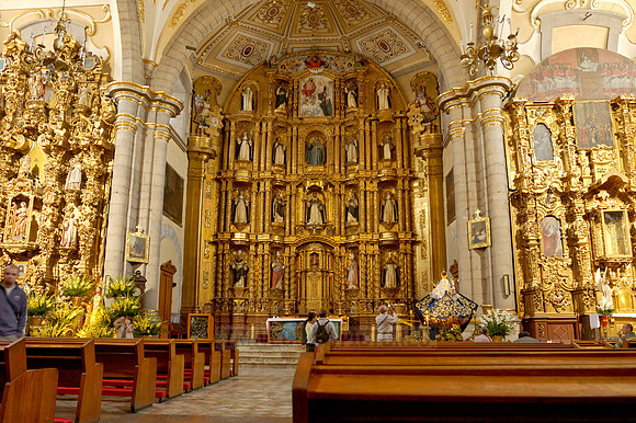 High altar richly decorated with gold, stucco and figures