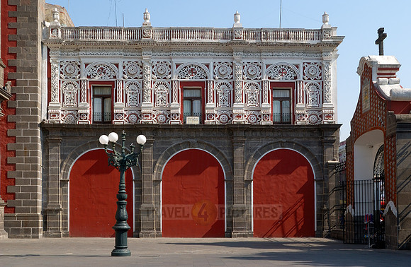 side building with rich decoration made of stucco, sugar baker's style
