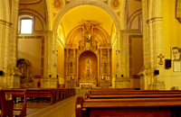 high altar decorated with gold and stucco