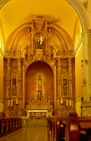 high altar decorated with gold and stucco