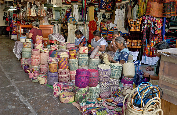 Indigenas with basketry from Oaxaca market