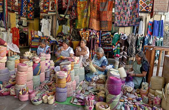Indigenas with basketry from Oaxaca market