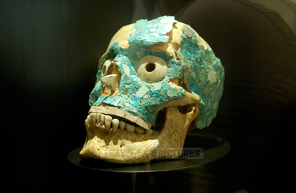 Human skull with turquoise mosaic
