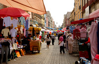 market stalls and lots of pedestrians