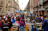 market stalls and lots of pedestrians