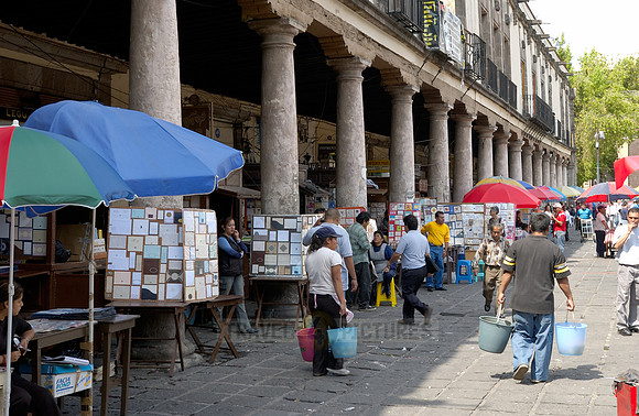 stalls with print products on Plaza Santo Domingo