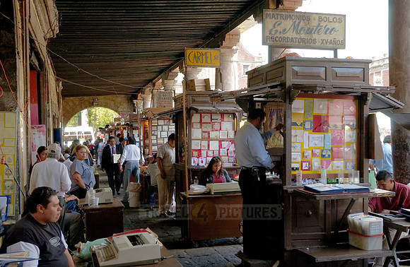 stalls with print products on Plaza Santo Domingo