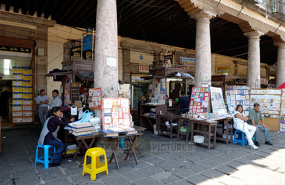 stalls with print products on Plaza Santo Domingo