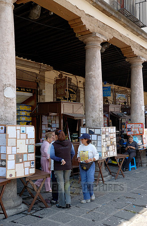 stalls with print products on Plaza Santo Domingo