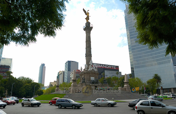 Independence Monument El Angel with surrounding office buildings