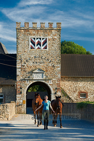 young lady with horses in front of Holzheim castle