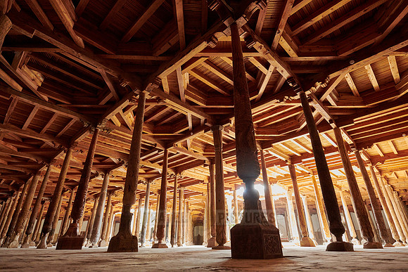 old wooden columns in Djuma Mosque old town Khiva