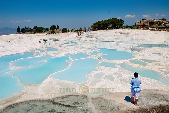 tourist in front of Pamukkale travertine terraces