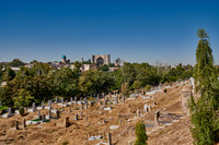 view from necropolis Shah-i-Zinda over regulare graves to Bibi-Khanym Mosque