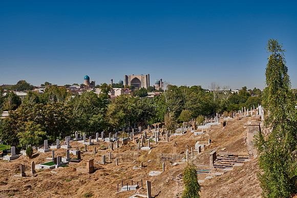view from necropolis Shah-i-Zinda over regulare graves to Bibi-Khanym Mosque