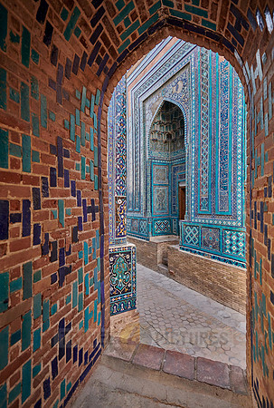 narrow path through facades heavily decorated with blue tiles in necropolis Shah-i-Zinda