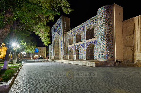 night shot of beautifully decorated Nadir Divan Begi madrassah