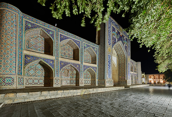 night shot of beautifully decorated Nadir Divan Begi madrassah