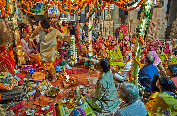 colorful hindu women during ceremony