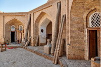 Carved wooden pillars in a carpentry shop in the old town Itchan-Kala