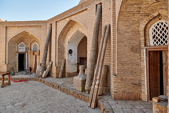 Carved wooden pillars in a carpentry shop in the old town Itchan-Kala
