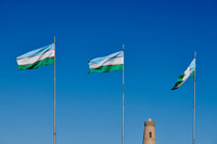 Three flags of Uzbekistan are waving in the wind