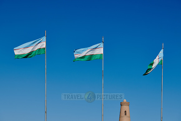 Three flags of Uzbekistan are waving in the wind