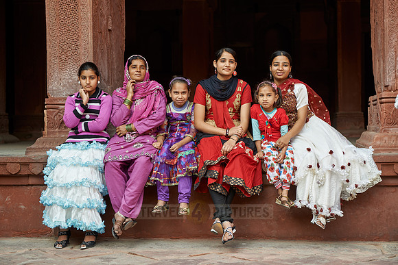 Group of traditionally dressed women and girls inside Agra Fort