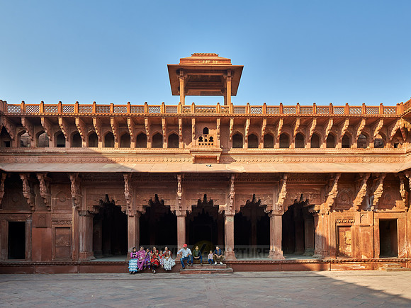 Group of traditionally dressed women and girls inside Agra Fort